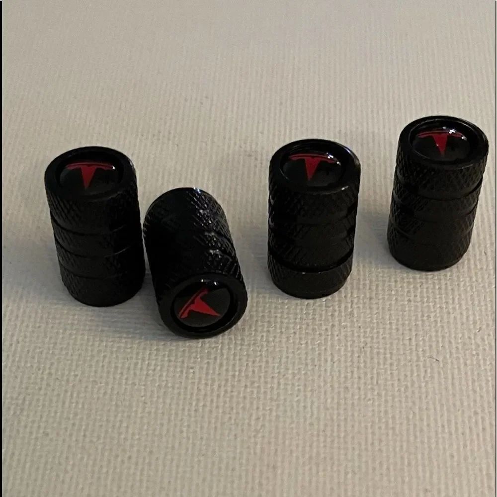 Tesla valve Stem caps in black set of 4 NWT